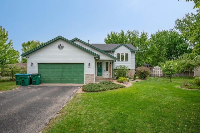 604 Brookview Ln SW, Isanti, MN 55040 - split level home featuring brick siding, asphalt driveway, a front lawn, and an attached garage