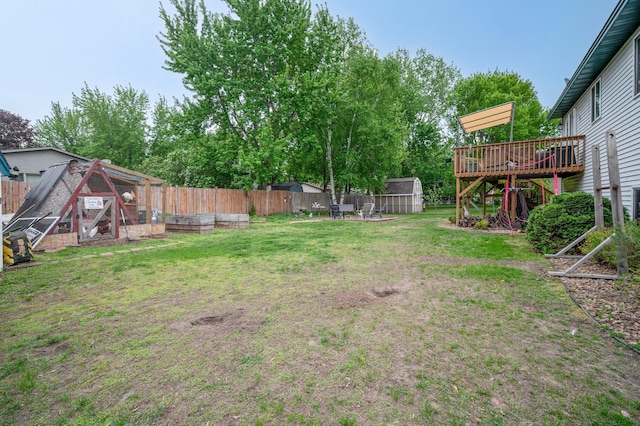 604 Brookview Ln SW, Isanti, MN 55040 - view of yard featuring a deck and exterior structure