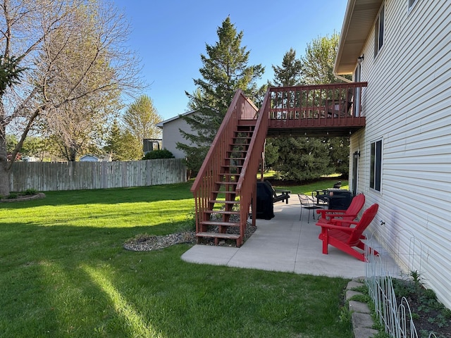 view of yard featuring stairway, a patio area, and a deck