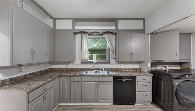 1001 Washington Memorial Dr, Saint Cloud, MN 56301 - kitchen with black dishwasher, a sink, washing machine and dryer, gray cabinetry, and dark countertops