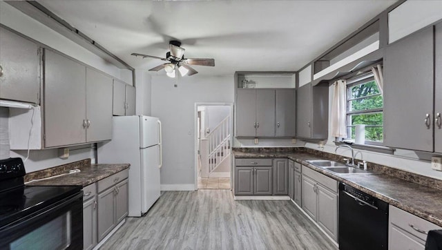 1001 Washington Memorial Dr, Saint Cloud, MN 56301 - kitchen with black appliances, gray cabinets, a sink, and dark countertops