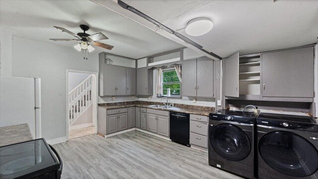 1001 Washington Memorial Dr, Saint Cloud, MN 56301 - clothes washing area with washing machine and dryer, a ceiling fan, light wood finished floors, and baseboards