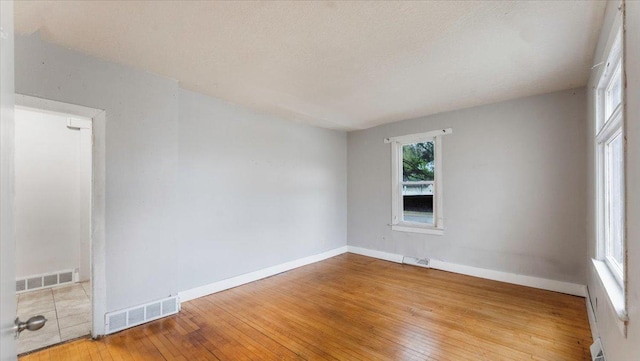 1001 Washington Memorial Dr, Saint Cloud, MN 56301 - empty room featuring wood-type flooring and baseboards