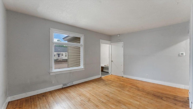1001 Washington Memorial Dr, Saint Cloud, MN 56301 - unfurnished room featuring baseboards and wood-type flooring
