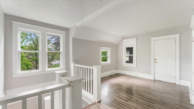 1001 Washington Memorial Dr, Saint Cloud, MN 56301 - corridor with an upstairs landing, vaulted ceiling, wood finished floors, and baseboards