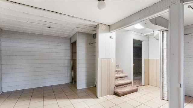 1001 Washington Memorial Dr, Saint Cloud, MN 56301 - corridor with tile patterned floors, stairway, and wood walls