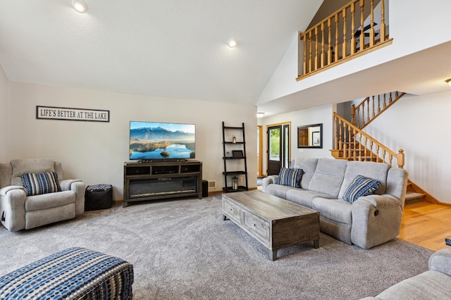 25306 Csah 4, Dassel Twp, MN 55325 - living room featuring stairway, carpet flooring, high vaulted ceiling, and baseboards