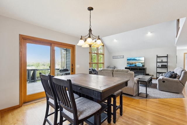25306 Csah 4, Dassel Twp, MN 55325 - dining space with a chandelier, light wood-style flooring, lofted ceiling, and baseboards