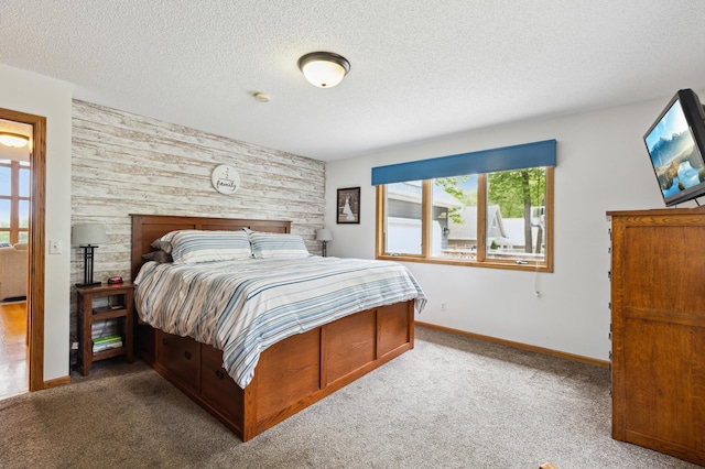 25306 Csah 4, Dassel Twp, MN 55325 - carpeted bedroom with an accent wall, wood walls, a textured ceiling, and baseboards
