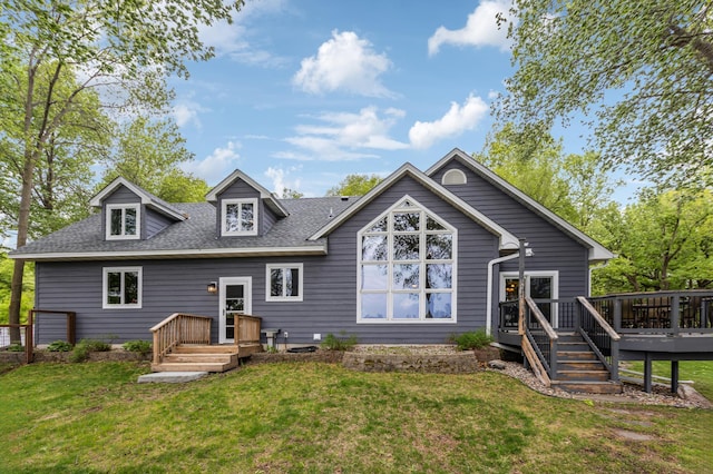 25306 Csah 4, Dassel Twp, MN 55325 - back of property featuring a shingled roof, a lawn, and a wooden deck