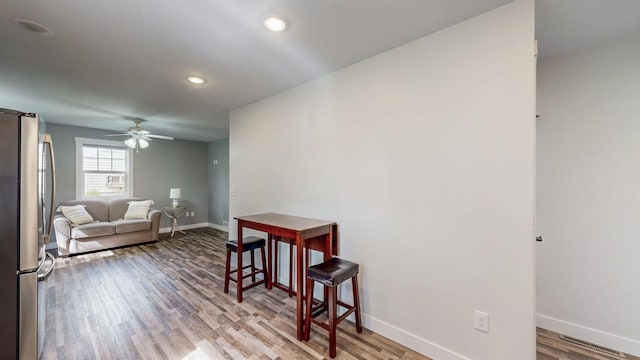 368 Main St, Zumbrota, MN 55992 - living room featuring baseboards, wood finished floors, a ceiling fan, and recessed lighting