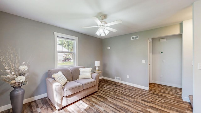 368 Main St, Zumbrota, MN 55992 - living area featuring wood finished floors, baseboards, and a ceiling fan