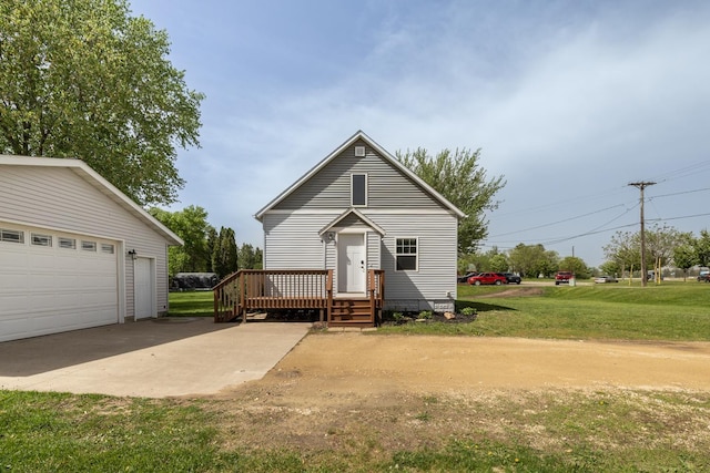 368 Main St, Zumbrota, MN 55992 - view of front facade featuring a front lawn, a deck, and a garage