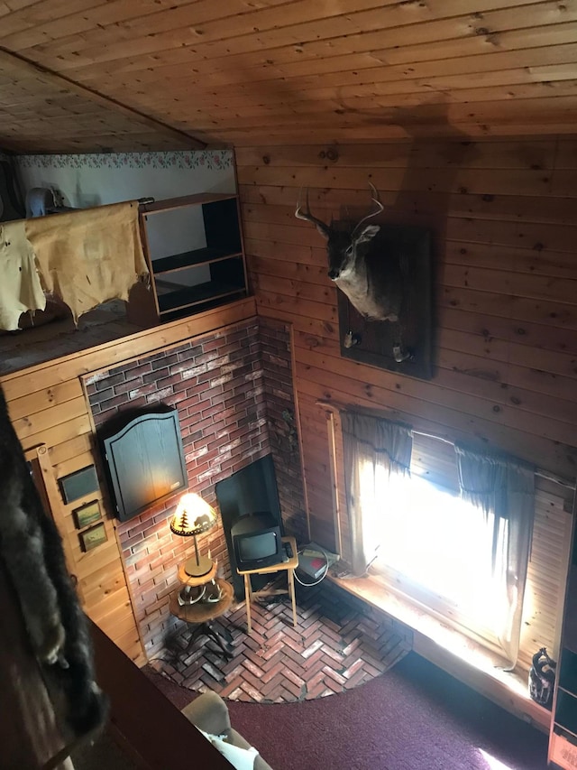 21 Brandon Ln, Grand Marais, MN 55604 - living room featuring wooden ceiling, wood walls, and carpet
