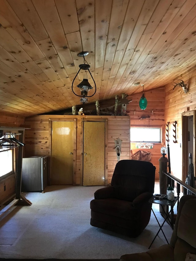 21 Brandon Ln, Grand Marais, MN 55604 - carpeted living area with wooden walls, vaulted ceiling, and wood ceiling