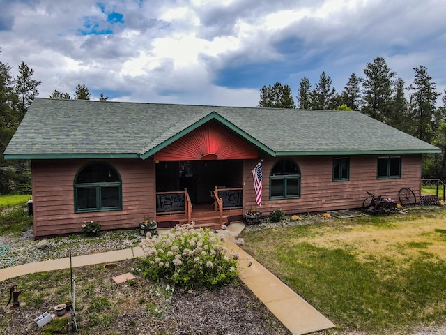 11782 150th St, Park Rapids, MN 56470 - chalet / cabin with a shingled roof, a porch, and a front lawn