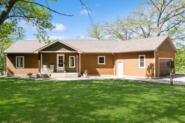 8259 Barton Ave NW, Buffalo, MN 55313 - rear view of property featuring roof with shingles, a yard, an attached garage, and covered porch