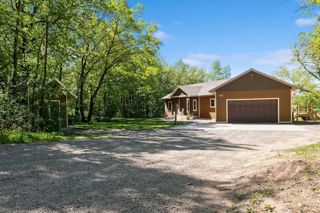 8259 Barton Ave NW, Buffalo, MN 55313 - view of front of house with covered porch, driveway, and a garage