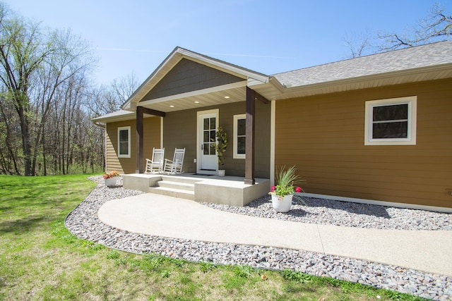 8259 Barton Ave NW, Buffalo, MN 55313 - entrance to property with covered porch and a lawn