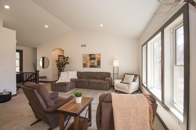 8259 Barton Ave NW, Buffalo, MN 55313 - carpeted living room with vaulted ceiling, arched walkways, and recessed lighting