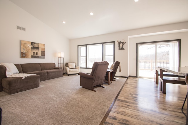 8259 Barton Ave NW, Buffalo, MN 55313 - living area featuring recessed lighting, wood finished floors, and high vaulted ceiling
