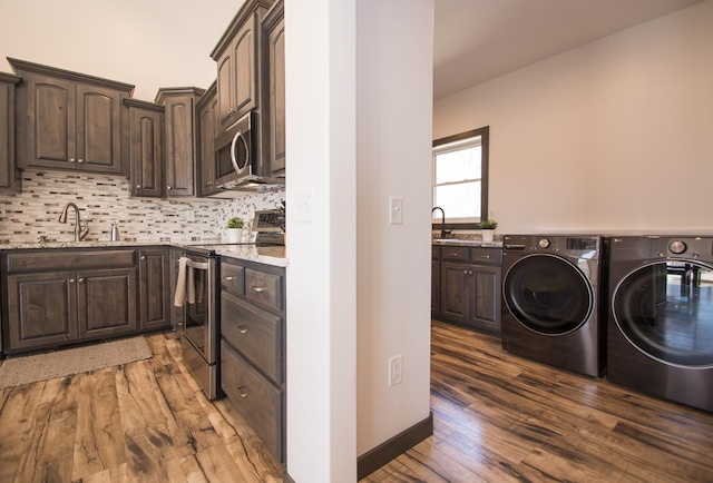 8259 Barton Ave NW, Buffalo, MN 55313 - laundry area with independent washer and dryer and wood finished floors