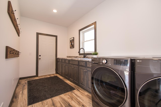 8259 Barton Ave NW, Buffalo, MN 55313 - washroom featuring washing machine and clothes dryer, cabinet space, light wood-type flooring, and recessed lighting
