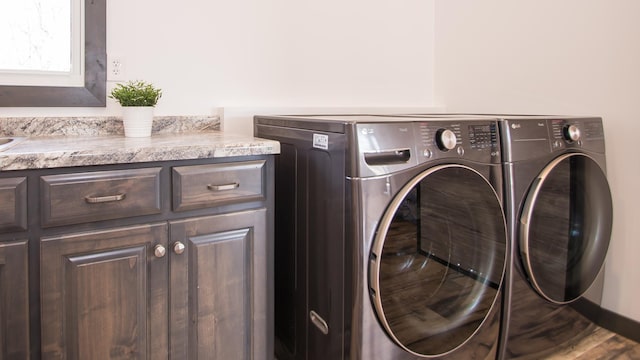 8259 Barton Ave NW, Buffalo, MN 55313 - laundry area with washing machine and dryer and cabinet space