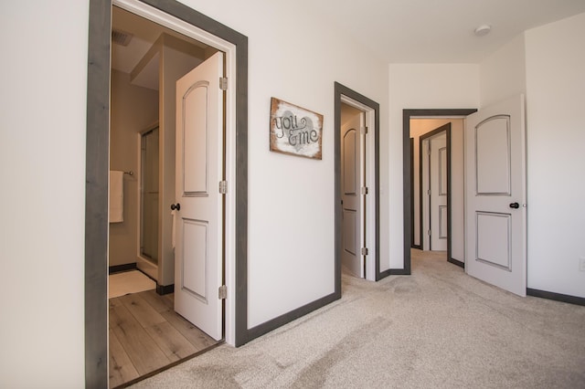 8259 Barton Ave NW, Buffalo, MN 55313 - hallway featuring light colored carpet and baseboards