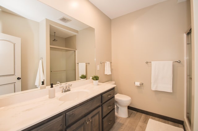 8259 Barton Ave NW, Buffalo, MN 55313 - full bath featuring a stall shower, vanity, and wood finished floors