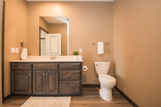 8259 Barton Ave NW, Buffalo, MN 55313 - half bath featuring vanity and wood finished floors