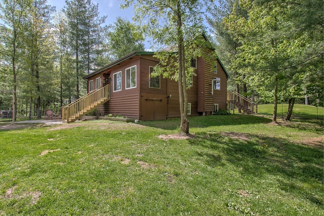 6000 152nd St, Milaca, MN 56353 - view of property exterior featuring stairway and a yard