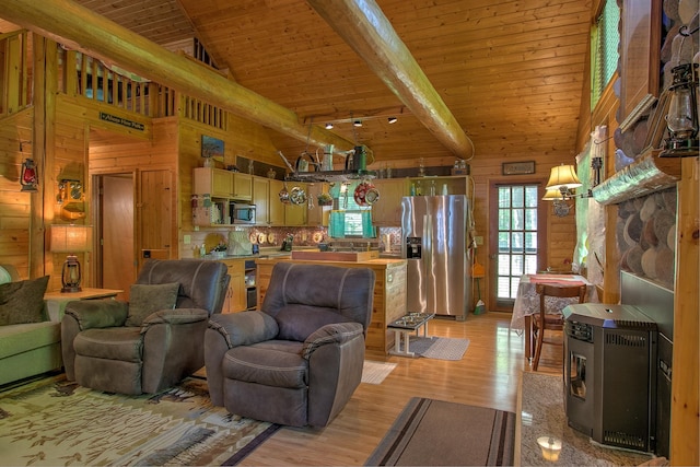 6000 152nd St, Milaca, MN 56353 - living area featuring wood ceiling with exposed beams, wood walls, light wood-style floors, and high vaulted ceiling