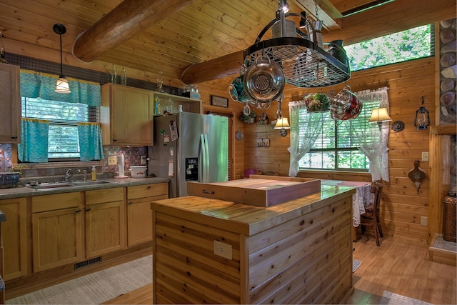 6000 152nd St, Milaca, MN 56353 - kitchen with stainless steel refrigerator with ice dispenser, wooden counters, a sink, light wood-type flooring, and wooden walls