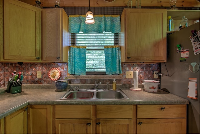 6000 152nd St, Milaca, MN 56353 - kitchen with freestanding refrigerator, a sink, decorative backsplash, and pendant lighting