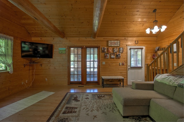 6000 152nd St, Milaca, MN 56353 - living area featuring wood finished floors, a chandelier, stairs, wood walls, and wooden ceiling