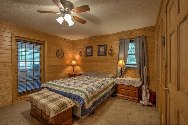 6000 152nd St, Milaca, MN 56353 - carpeted bedroom featuring a textured ceiling, wooden walls, and ceiling fan