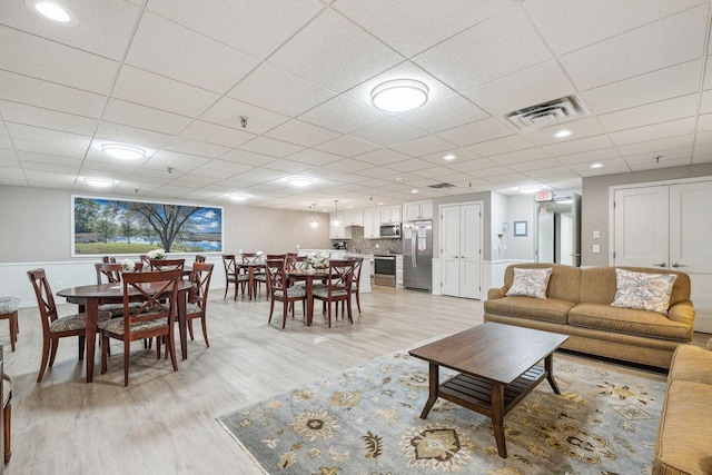 4360 Brookside Ct Unit 206, Edina, MN 55436 - living room featuring light wood-type flooring and a drop ceiling