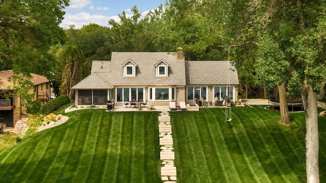1397 Orono Ln, Orono, MN 55391 - back of house with a yard, a patio area, and a sunroom