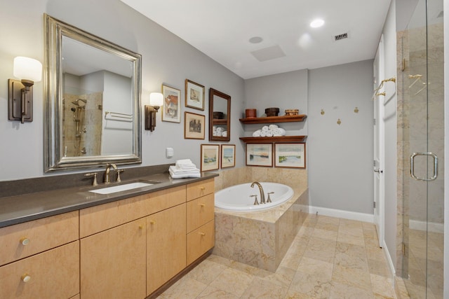 100 3rd Ave S Unit 3301, Minneapolis, MN 55401 - full bathroom featuring a stall shower, a garden tub, vanity, and baseboards