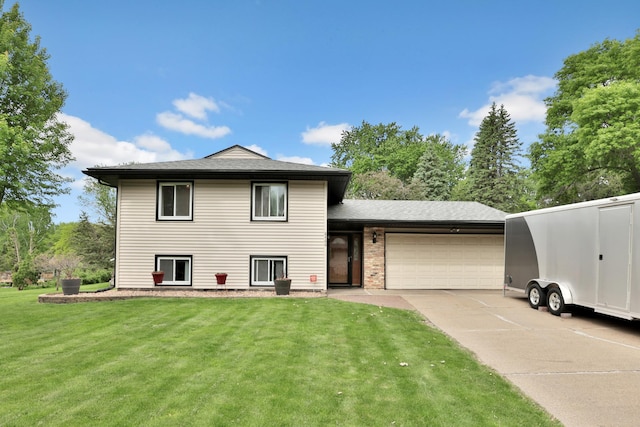 8466 Isleton Ct S, Cottage Grove, MN 55016 - view of front facade with a garage, a front yard, and concrete driveway