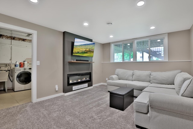 8466 Isleton Ct S, Cottage Grove, MN 55016 - carpeted living area featuring washer / clothes dryer, recessed lighting, baseboards, and a glass covered fireplace