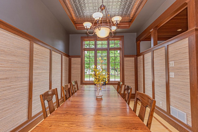 8599 County Road 21 SW, Alexandria, MN 56308 - unfurnished dining area featuring a raised ceiling, a chandelier, and an ornate ceiling