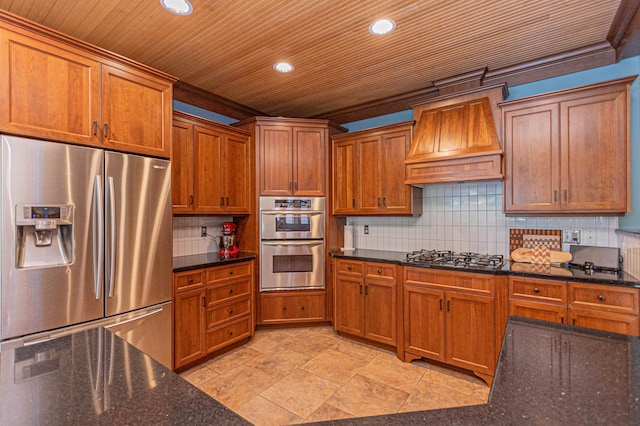 8599 County Road 21 SW, Alexandria, MN 56308 - kitchen with appliances with stainless steel finishes, custom exhaust hood, brown cabinetry, recessed lighting, and backsplash