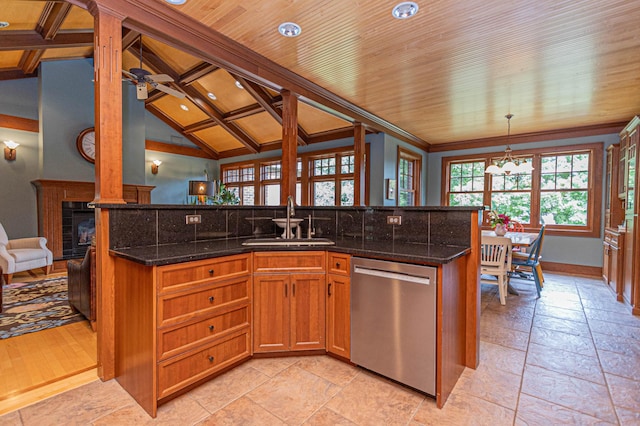 8599 County Road 21 SW, Alexandria, MN 56308 - kitchen with stainless steel dishwasher, a sink, stone tile floors, dark stone countertops, and recessed lighting