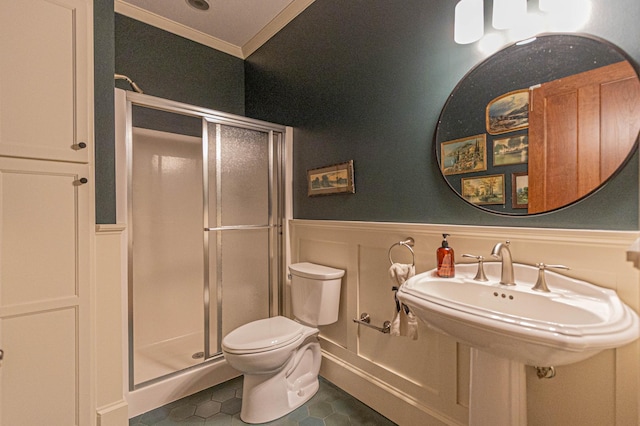 8599 County Road 21 SW, Alexandria, MN 56308 - bathroom with crown molding, wainscoting, a shower stall, toilet, and tile patterned floors