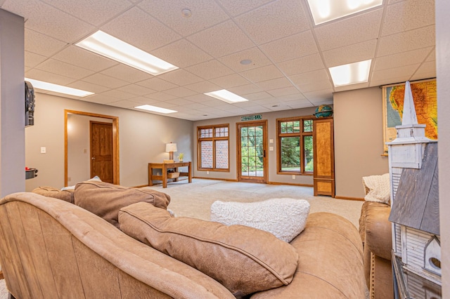 8599 County Road 21 SW, Alexandria, MN 56308 - carpeted living area with a paneled ceiling and baseboards