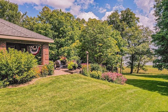 8599 County Road 21 SW, Alexandria, MN 56308 - view of grassy yard featuring a patio area