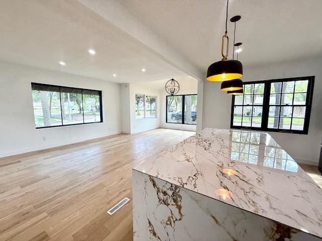 503 3rd St, Redwood Falls, MN 56283 - unfurnished dining area with light wood-style flooring, recessed lighting, and baseboards