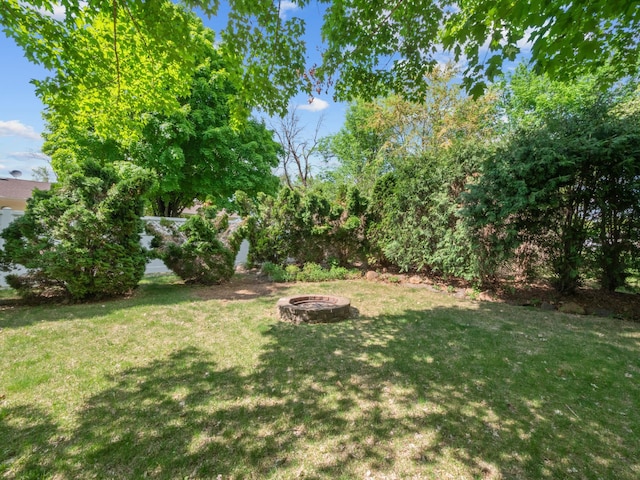 835 Winona Dr SW, Alexandria, MN 56308 - view of green lawn featuring a fire pit